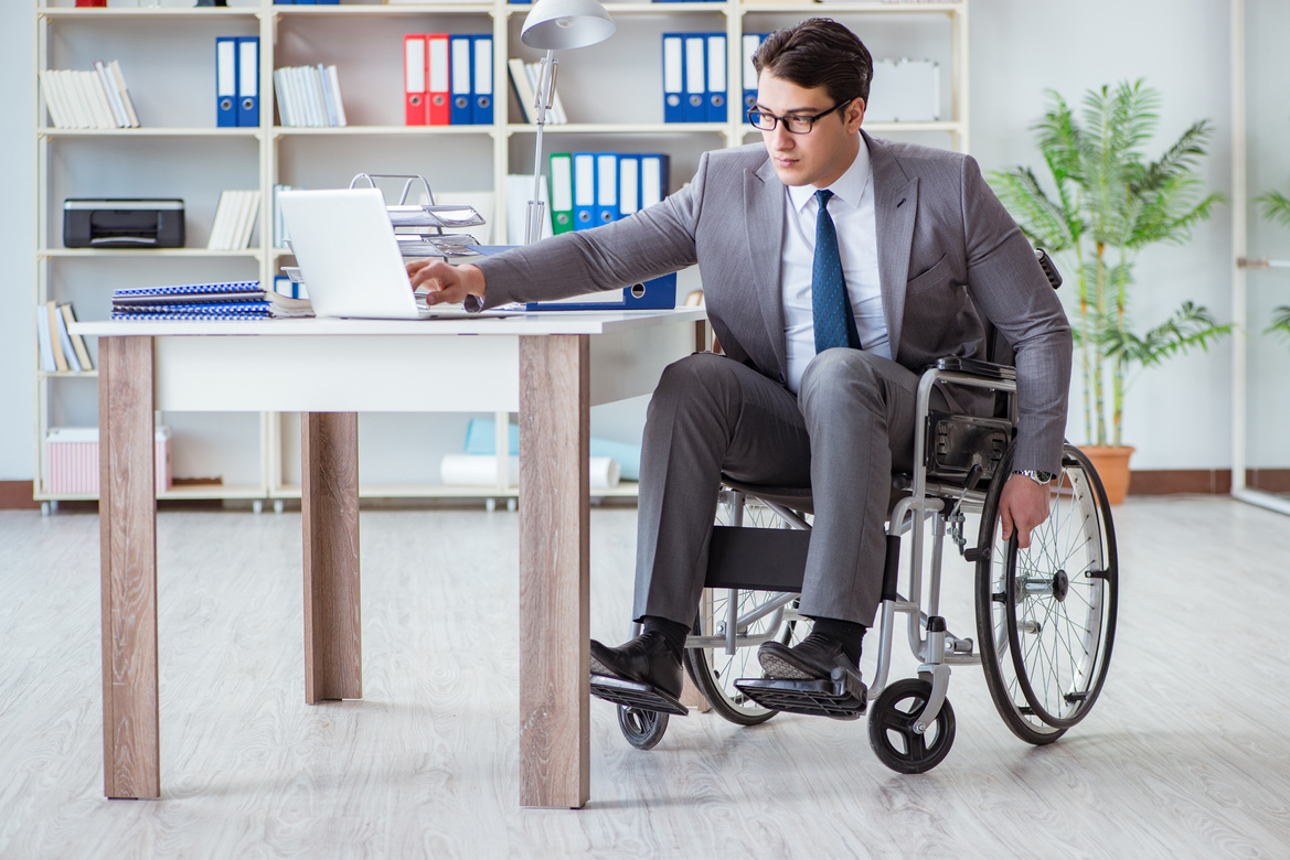 Disabled Businessman Working in Office